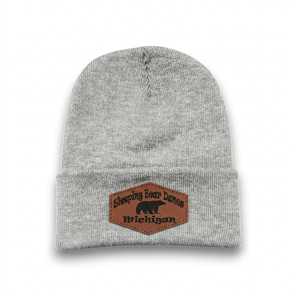 Dark heather grey knit beanie with Sleeping Bear Dunes Michigan logo patch