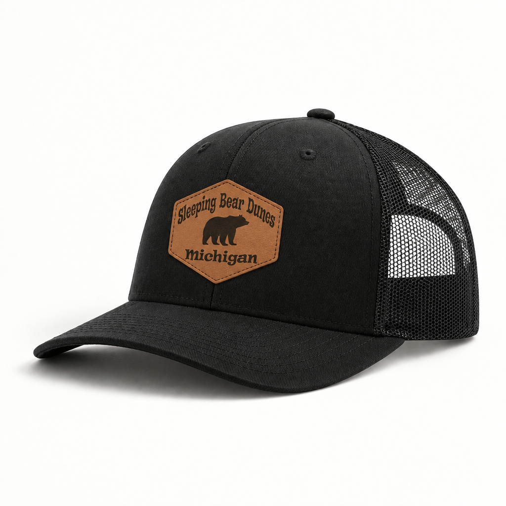 Black trucker hat with black mesh back; brown patch with bear icon and Michigan