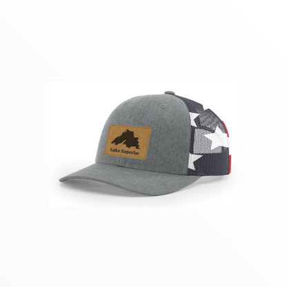 Gray trucker hat with Lake Superior patch and patterned mesh side with red accent