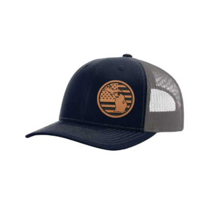 Navy trucker hat with circular Michigan patch and gray mesh side back panel