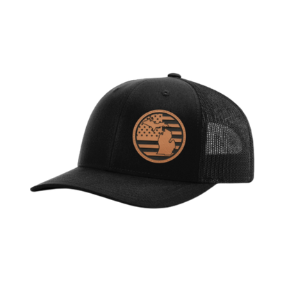 Trucker hat with round Michigan patch, black front and dark gray mesh back.