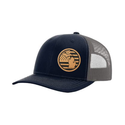 Navy trucker hat with circular Michigan patch and gray mesh back panel