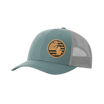 Trucker hat with round Michigan patch, teal front and gray mesh back.