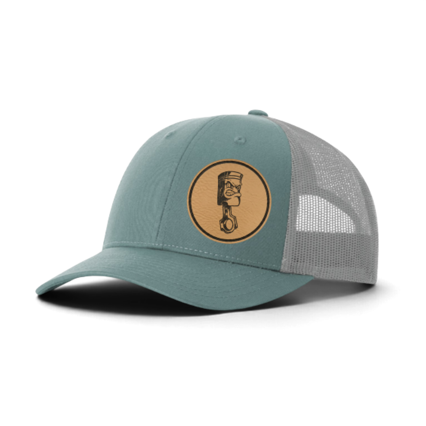 Teal trucker cap with circular piston patch and light gray mesh side panels