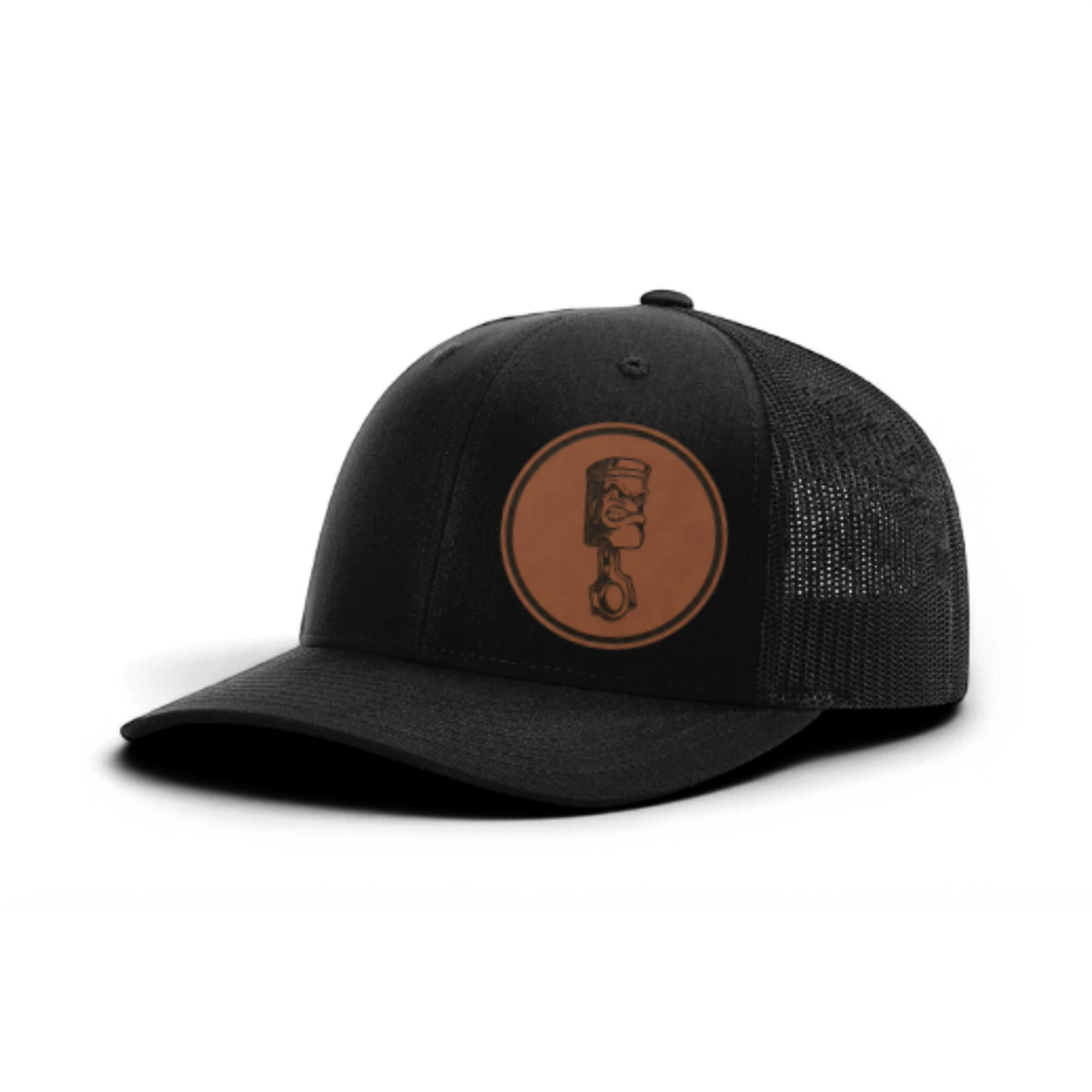 Trucker hat with angry piston patch, dark charcoal front and black mesh back panels.
