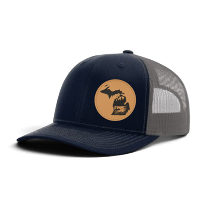 Navy trucker hat with circular fish patch; gray mesh side panels