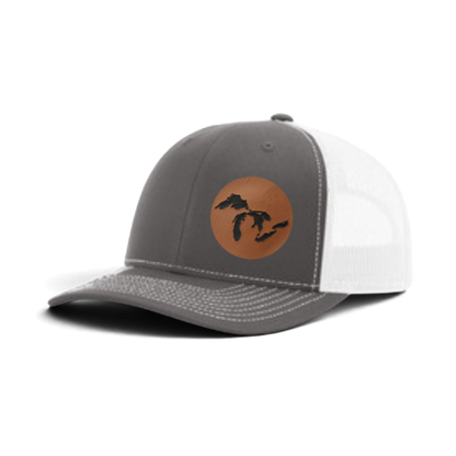 Gray and white trucker hat with tan patch and black silhouette; white mesh back panel