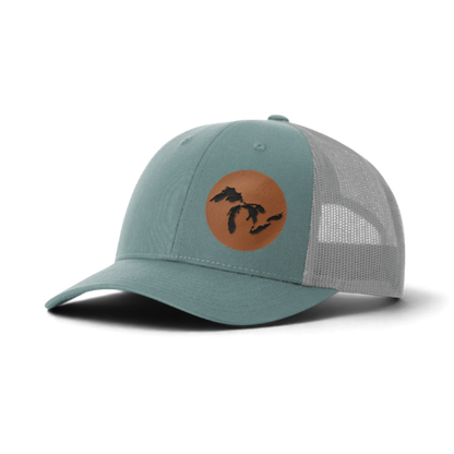 Teal trucker cap with circular Michigan silhouette patch on front and mesh back