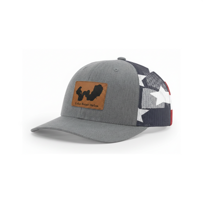 Gray trucker hat with tan Lake Saint Helen patch and star-pattern mesh back.