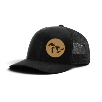 Black trucker hat with circular Michigan silhouette patch and mesh side panels