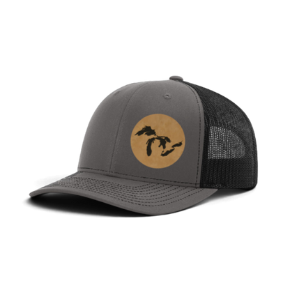 Heather gray trucker hat with tan patch and black silhouette; dark gray mesh back