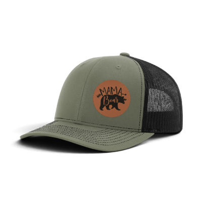 Olive green trucker hat with dark mesh and brown “MAMA Bear” patch.