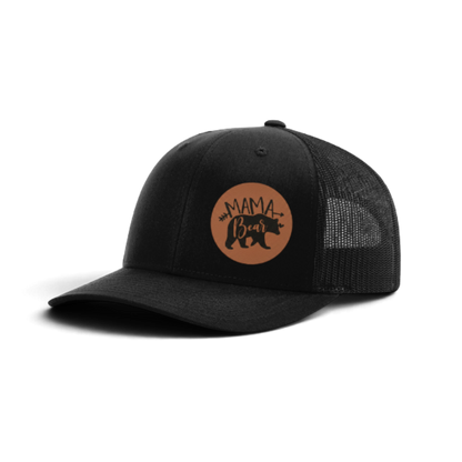 Black trucker hat with black mesh and brown “MAMA Bear” patch.