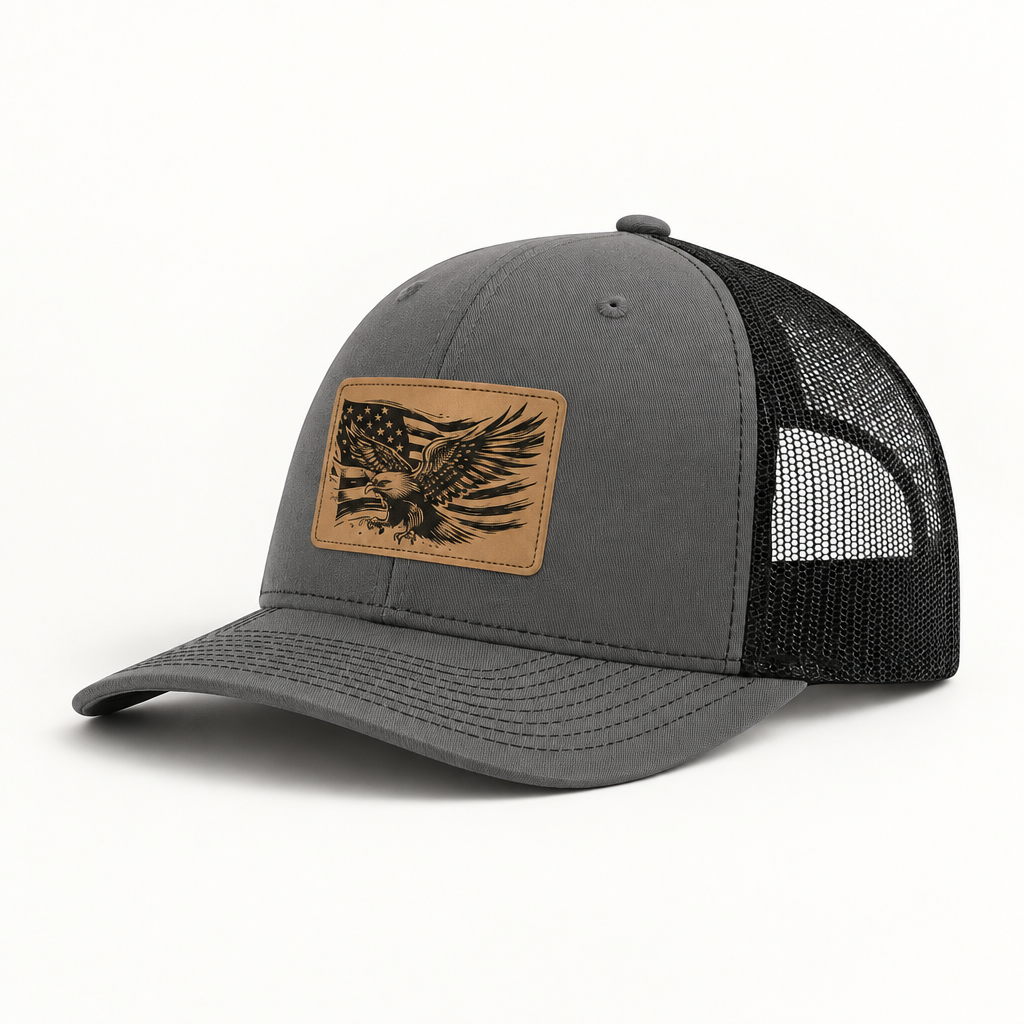 Gray and black mesh trucker hat with American flag eagle patch, curved brim