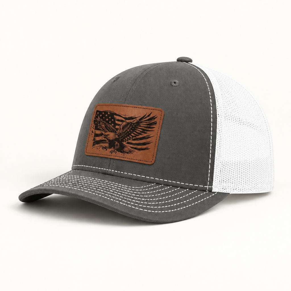 Grey trucker hat with eagle American flag patch and white mesh side panels