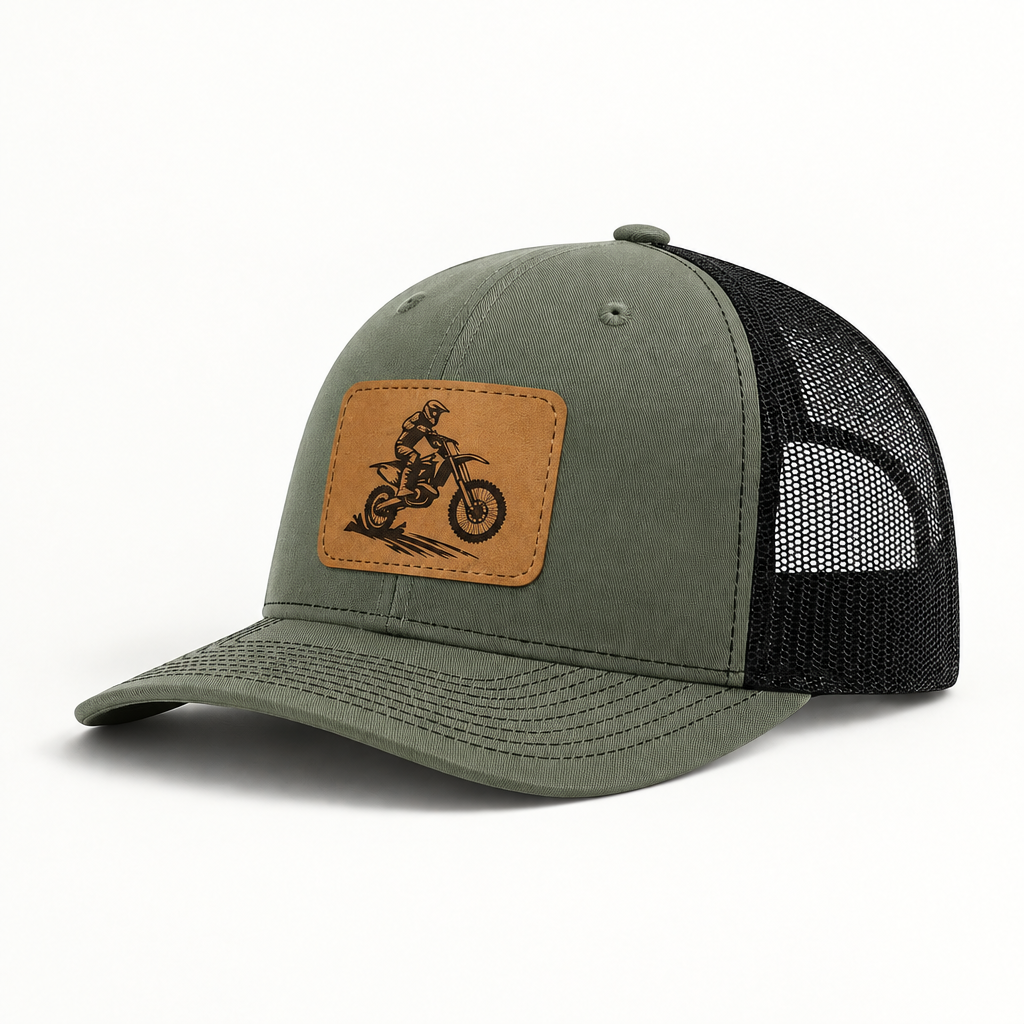 Olive green trucker hat with tan dirt bike patch and black mesh side panels