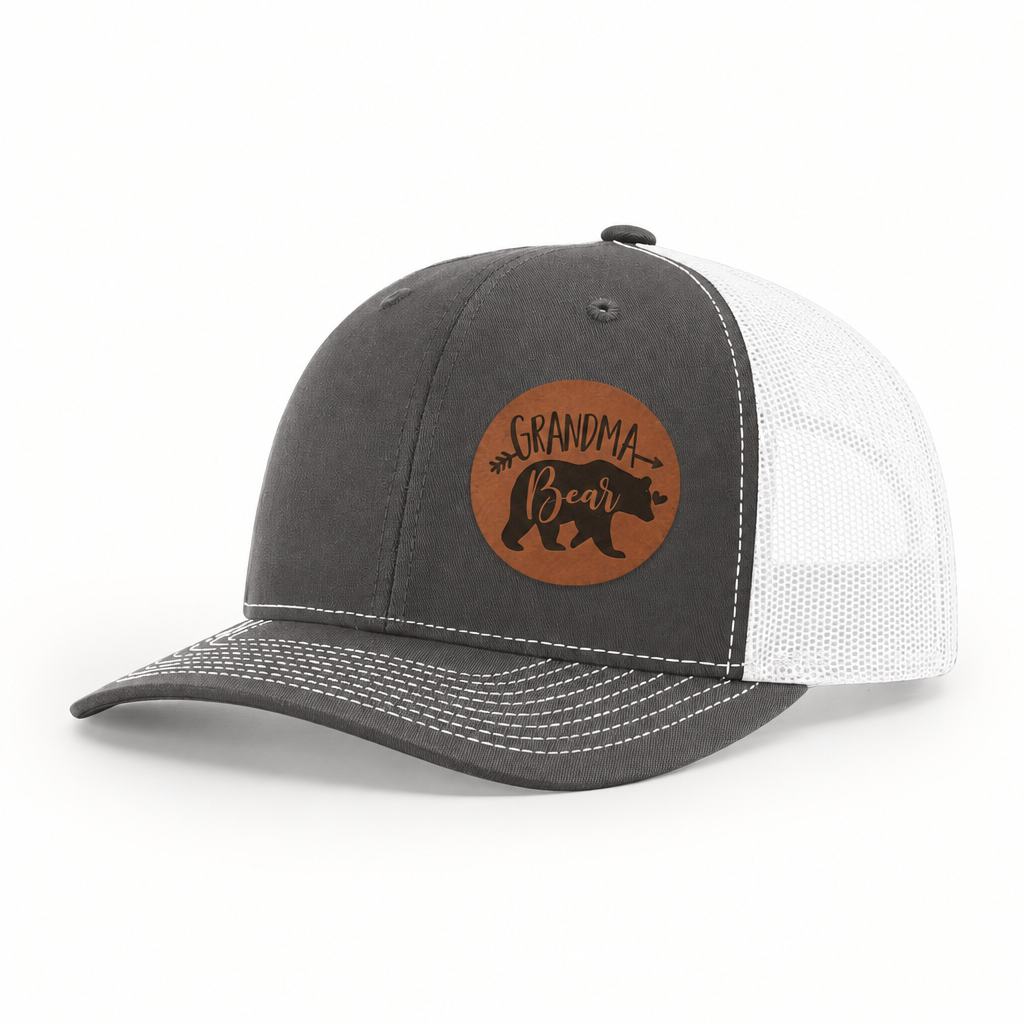 Dark gray trucker hat with Grandma Bear round patch and white mesh side panels