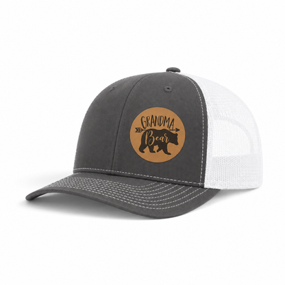 Dark gray trucker hat with Grandma Bear round patch and white mesh side panels