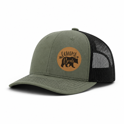 Olive green trucker hat with Grandma Bear round patch and black mesh side panels
