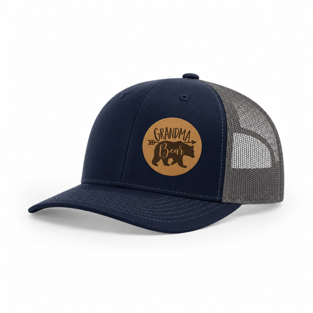Navy trucker hat with Grandma Bear round patch and gray mesh side panels