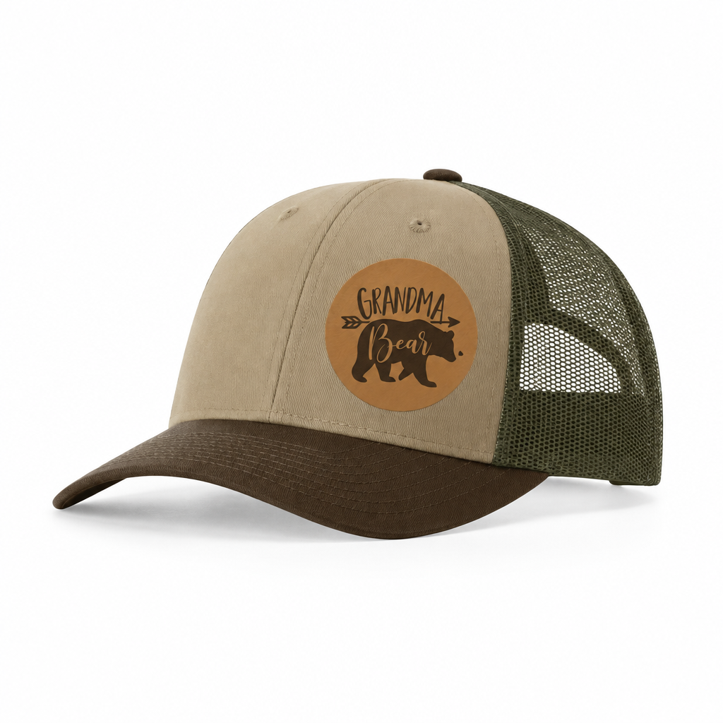 Tan and dark green trucker hat with brown Grandma Bear patch and mesh panels.
