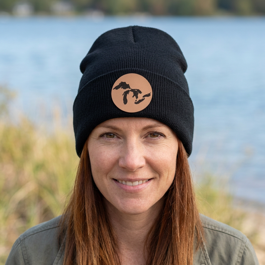 Black knit beanie with a circular patch logo