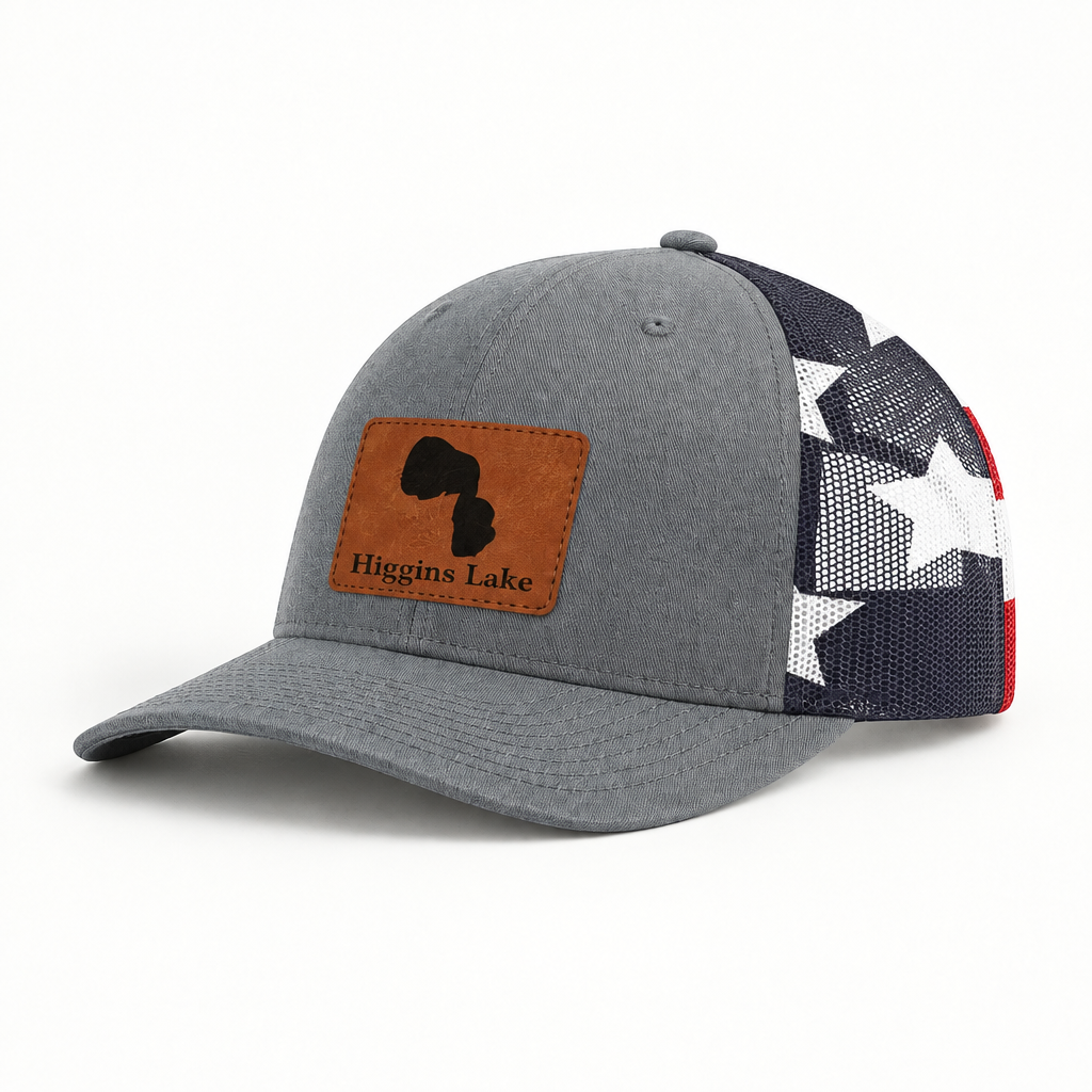 Trucker hat with tan patch, gray front and black mesh star panel, curved brim