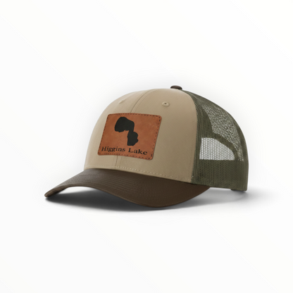 Trucker hat with brown Higgins Lake patch, tan front and dark brown mesh back.