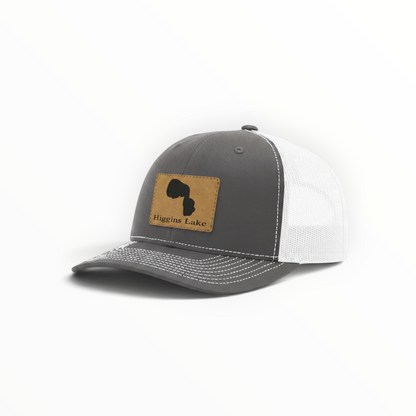 Dark gray trucker hat with Higgins Lake patch and white mesh back, curved brim