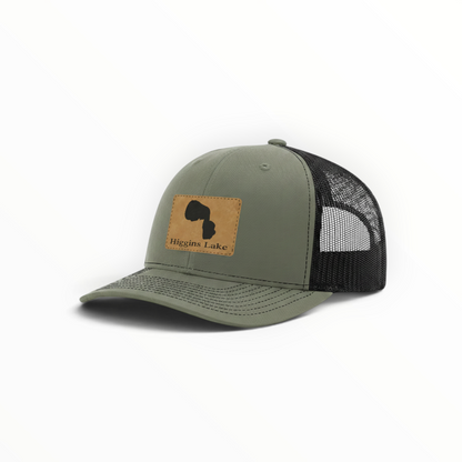 Olive green trucker hat with Higgins Lake patch and black mesh back, curved brim