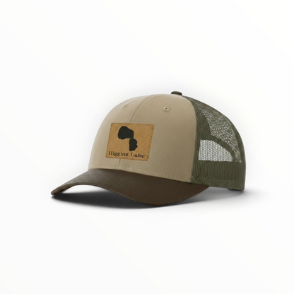 Tan trucker hat with Higgins Lake patch and dark green mesh back, curved brim