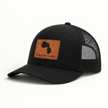 Black trucker hat with black mesh back and tan patch featuring a black state silhouette