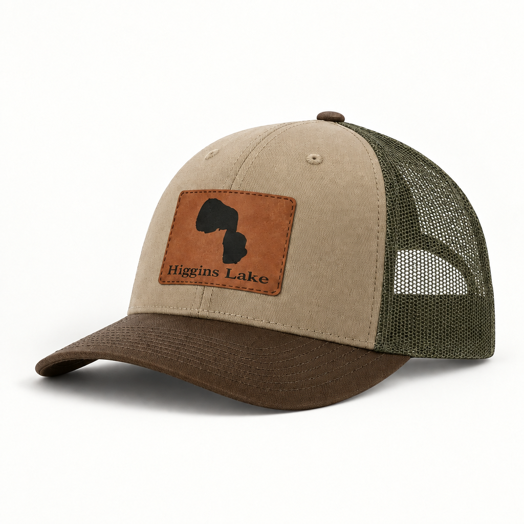 Beige trucker hat with olive mesh back and brown leather-look patch on front