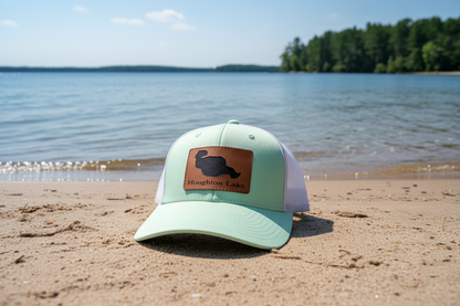 Trucker hat with Houghton Lake patch, mint crown with structured curved brim
