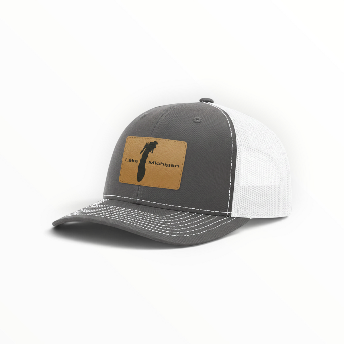 Light gray trucker hat with tan patch and white mesh back, curved brim