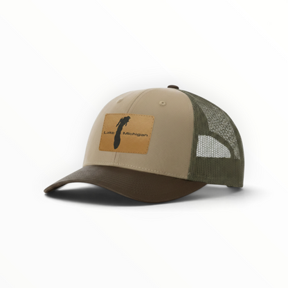 Tan trucker cap with dark green mesh and brown Lake Michigan front patch