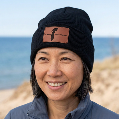 Black beanie with Lake Michigan patch, worn with blue jacket