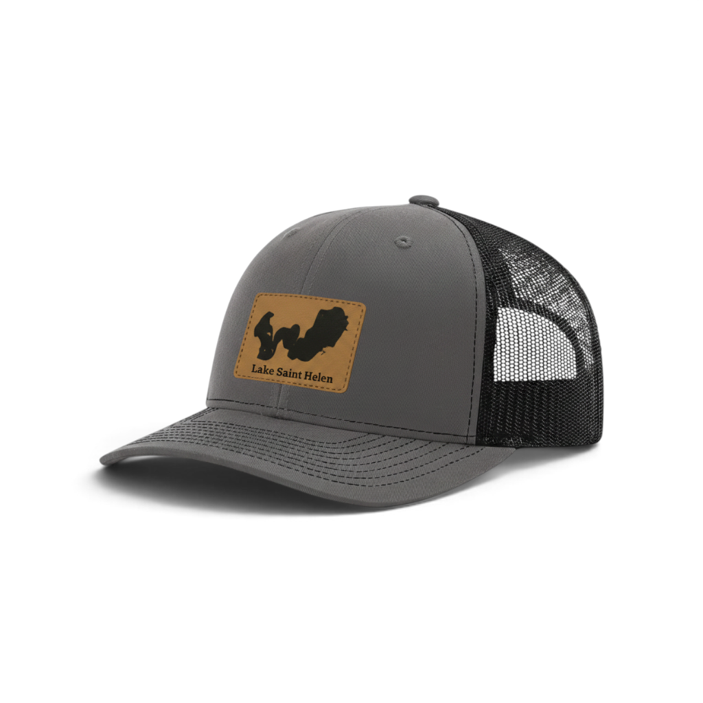 Dark gray trucker hat with black mesh and tan patch featuring Lake Saint Helen logo