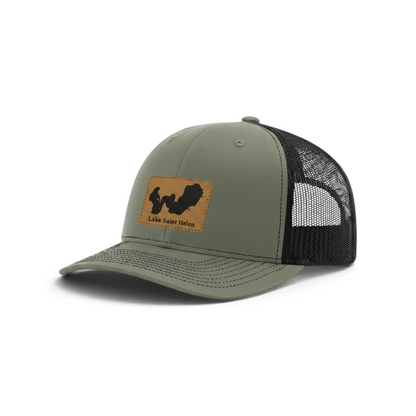 Olive green trucker hat with black mesh and tan patch featuring Lake Saint Helen logo