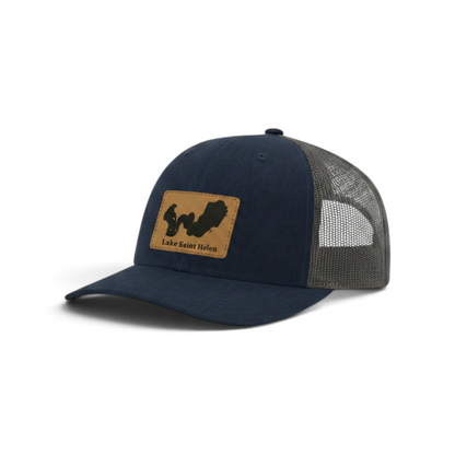Navy trucker hat with gray mesh back and tan front patch
