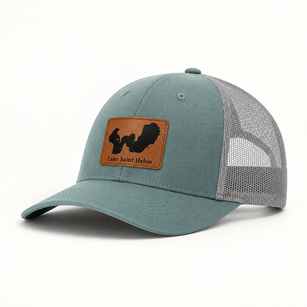 Teal trucker hat with mesh back and tan-bordered patch reading Lake Saint Helen.