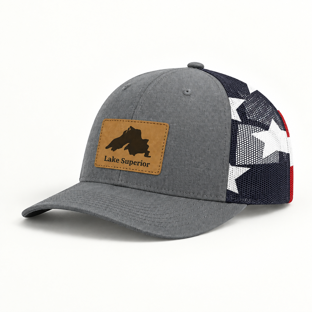 Gray trucker hat with black mesh back and tan “Lake Superior” patch