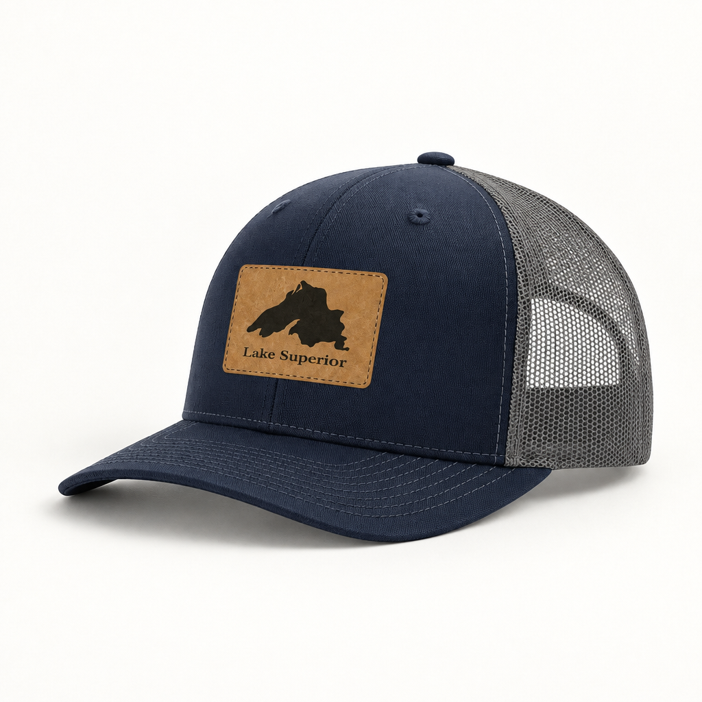 Navy trucker hat with gray mesh back and tan “Lake Superior” patch