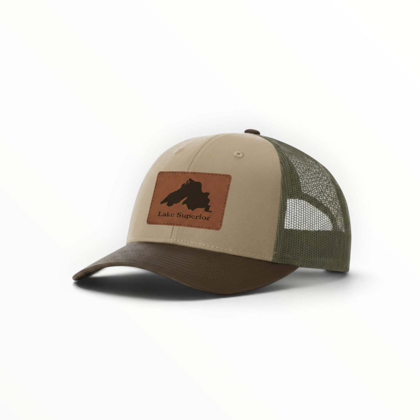 Two-tone trucker hat in tan and dark green with Lake Superior patch and curved brim