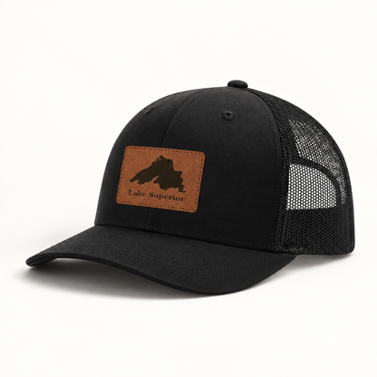 Lake Superior patch trucker hat with black crown and mesh side panels