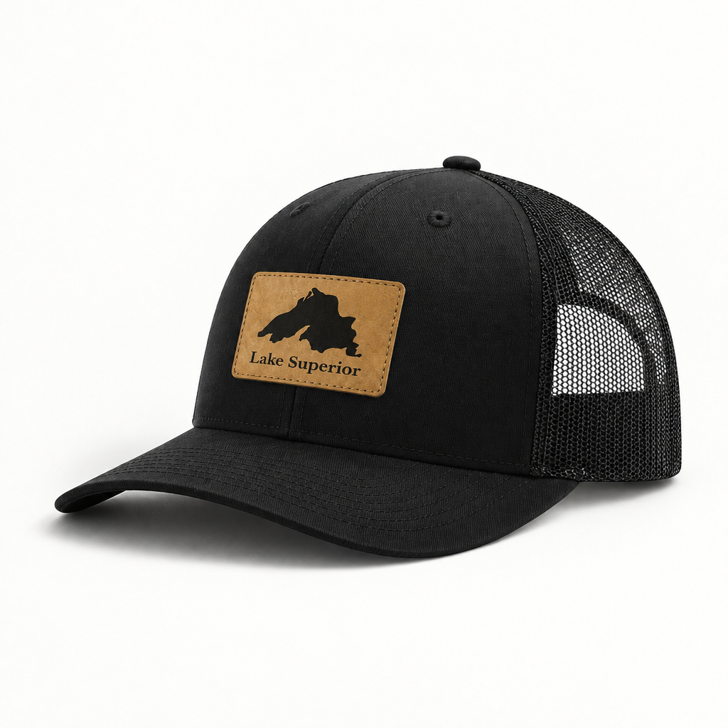 Lake Superior patch trucker hat with black crown, black mesh back, curved brim