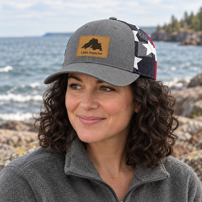 Gray trucker hat with front patch and star-pattern mesh sides