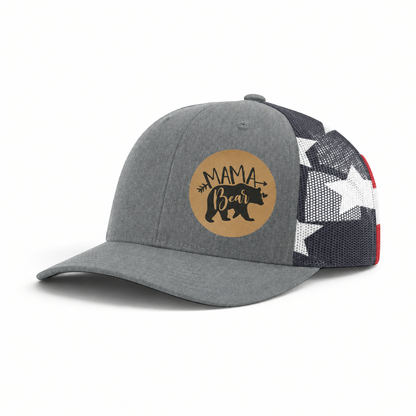 Gray trucker hat with black mesh back and tan “Mama Bear” patch.