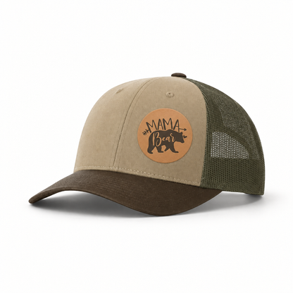 Khaki trucker hat with tan “Mama Bear” patch, brown brim, and green mesh back.
