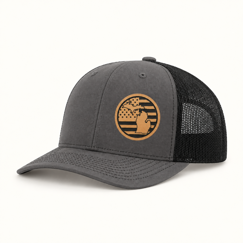 Charcoal trucker hat with round Michigan patch; black mesh back